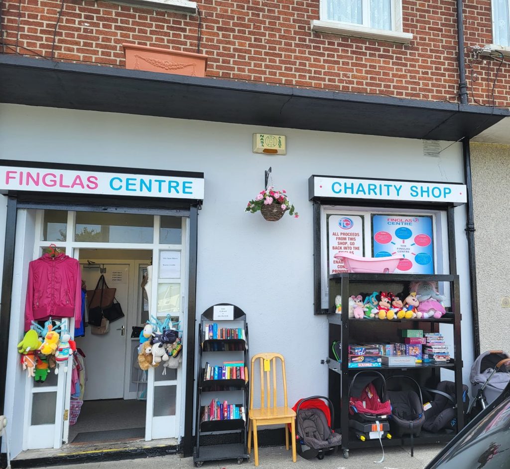 Exterior of The Finglas Centre charity shop with entrance and signage