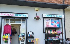 Exterior of The Finglas Centre charity shop with entrance and signage