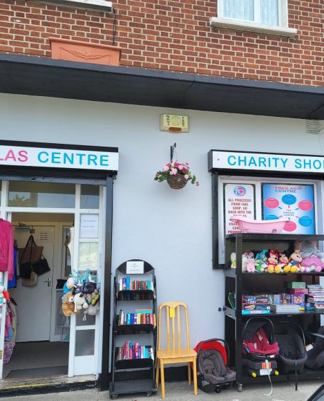 Exterior of The Finglas Centre charity shop with entrance and signage