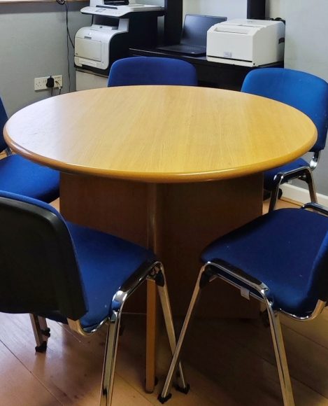 Close-up of a circular table with chairs in a Finglas Centre meeting room