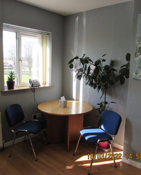 Finglas Centre room with a table and chairs in the corner