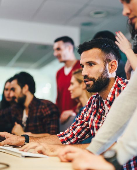 Programmers collaborating on software development in an office